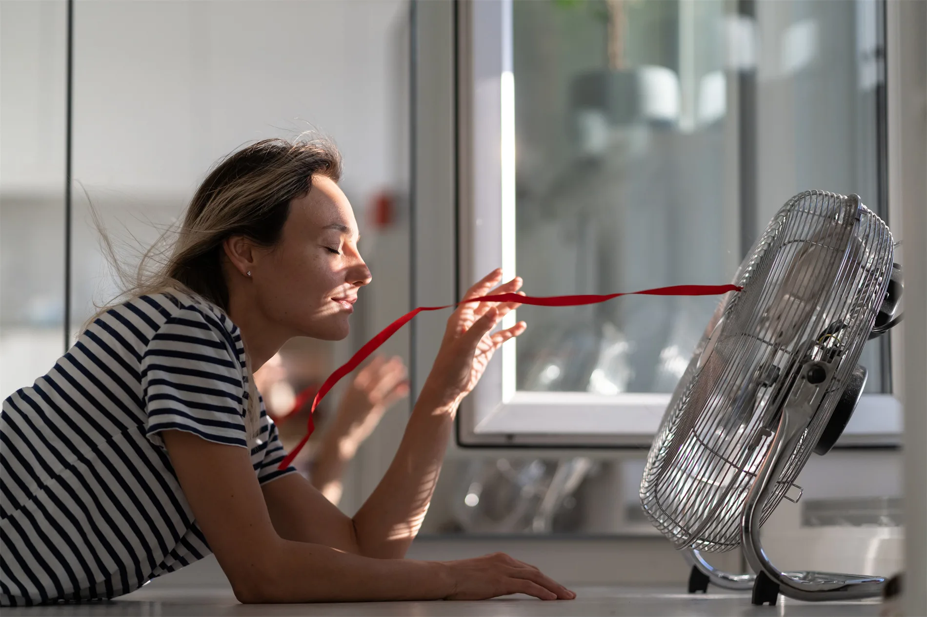 Customer enjoying fresh air from a fan